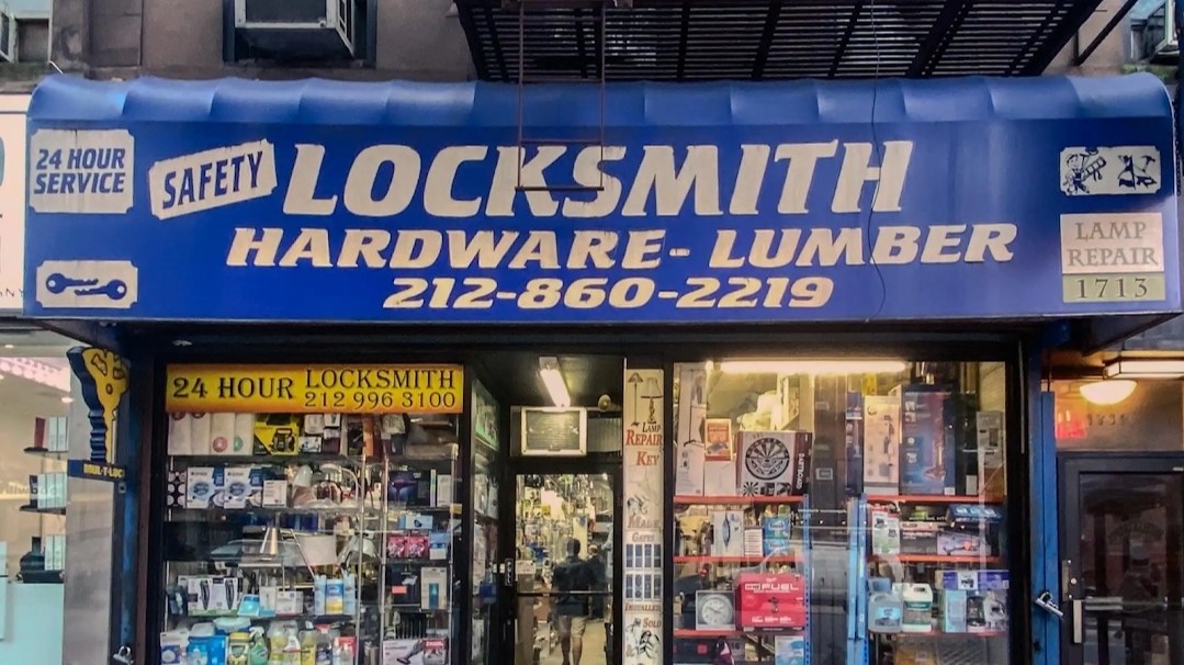 The Safety Locksmith and Hardware storefront with its blue awning at 1713 Second Ave