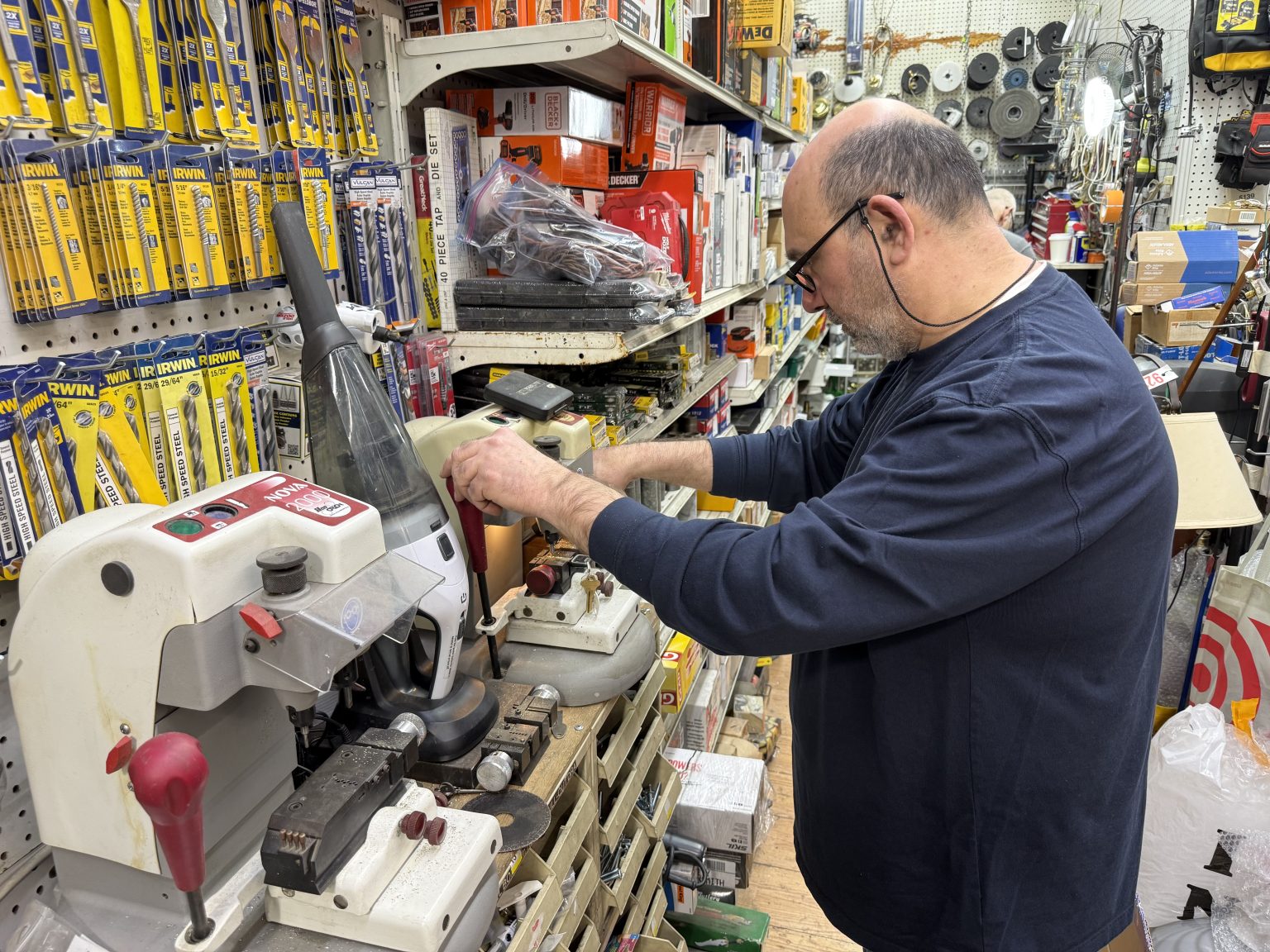 Inside the Safety Hardware store, aisles stocked floor to ceiling